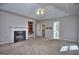 Open main bedroom with fireplace, built-in shelving, and neutral walls at 2808 Autumn Lake Ln # D/6, Decatur, GA 30034