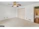 Bright bedroom featuring a ceiling fan, carpeted floors and closet at 230 Acorn Ct, Mcdonough, GA 30253