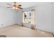 Bright bedroom featuring a ceiling fan, window with blinds and neutral carpet at 230 Acorn Ct, Mcdonough, GA 30253
