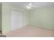 Bright bedroom featuring a ceiling fan, carpeted floors and closet at 230 Acorn Ct, Mcdonough, GA 30253