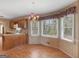Bright breakfast nook with large windows and adjacent kitchen space at 230 Acorn Ct, Mcdonough, GA 30253
