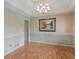 Formal dining room featuring elegant chandelier, and hardwood flooring at 230 Acorn Ct, Mcdonough, GA 30253