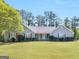 Charming single-story home with well-manicured lawn and mature trees in a quiet neighborhood at 230 Acorn Ct, Mcdonough, GA 30253