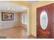 Inviting foyer with wood-look flooring, painting on the wall, and a decorative chandelier at 230 Acorn Ct, Mcdonough, GA 30253