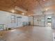 Well-lit garage featuring pegboard walls, overhead lighting, and ample storage with garage door to the right at 230 Acorn Ct, Mcdonough, GA 30253