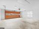 Spacious garage showcasing ample space and overhead lighting at 230 Acorn Ct, Mcdonough, GA 30253