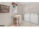 Functional laundry room with washer, dryer, and prep table at 230 Acorn Ct, Mcdonough, GA 30253