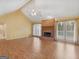 Bright living room with vaulted ceiling, fireplace, and access to the backyard at 230 Acorn Ct, Mcdonough, GA 30253