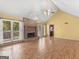 Living room with a brick fireplace, large windows, and laminate flooring at 230 Acorn Ct, Mcdonough, GA 30253