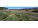 Fenced homesite featuring a gated entrance and views of the pasture for a custom build at 1761 Reavesville Rd, Bowdon, GA 30108