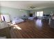 A very large bedroom with hardwood floors, a ceiling fan, and multiple beds, dressers and desks at 1761 Reavesville Rd, Bowdon, GA 30108