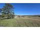 Spacious property featuring a well-maintained lawn and a charming home with a farmhouse-style facade at 1761 Reavesville Rd, Bowdon, GA 30108