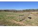 Open land with a rustic fence, presenting a blank canvas for various uses and enjoying nature's beauty at 1761 Reavesville Rd, Bowdon, GA 30108