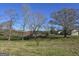 Spacious property with outbuildings, mature trees, and open fields, offering a serene setting at 1761 Reavesville Rd, Bowdon, GA 30108
