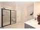 Modern bathroom featuring a glass enclosed shower with marble tile and modern fixtures at 10414 Trellis Lane (Lot 36), Hampton, GA 30228