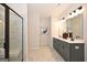 Modern bathroom featuring a glass enclosed shower with marble tile and dual sink vanity at 10414 Trellis Lane (Lot 36), Hampton, GA 30228
