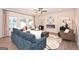 Inviting living room with a cozy fireplace, neutral colors, and an array of stylish furnishings at 10414 Trellis Lane (Lot 36), Hampton, GA 30228
