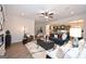 Expansive living area with an open layout, modern fireplace, hardwood floors, and comfortable seating at 10414 Trellis Lane (Lot 36), Hampton, GA 30228