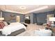 Bright main bedroom features neutral carpeting, recessed lighting, and modern decor at 10414 Trellis Lane (Lot 36), Hampton, GA 30228