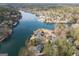 Scenic aerial view of lakefront homes nestled among lush forests and serene waters at 1190 Plantation Dr, Villa Rica, GA 30180