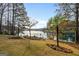 Lakeside backyard with boat dock and manicured lawn at 1190 Plantation Dr, Villa Rica, GA 30180