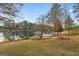 Lakeside backyard with a covered boat dock at 1190 Plantation Dr, Villa Rica, GA 30180