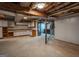 Spacious unfinished basement with exposed beams, open layout, and utility connections, ready for customization at 1190 Plantation Dr, Villa Rica, GA 30180