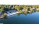 Aerial view of the waterfront with a sandy beach and community clubhouse at 1190 Plantation Dr, Villa Rica, GA 30180