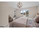 Inviting bedroom features a lake view, elegant lighting, and a cozy reading nook, creating a serene retreat at 1190 Plantation Dr, Villa Rica, GA 30180