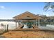 Covered boat dock with fish decoration, boat slips, and grassy lawn at 1190 Plantation Dr, Villa Rica, GA 30180