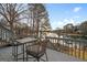 Outdoor dining on the deck overlooking the lake at 1190 Plantation Dr, Villa Rica, GA 30180