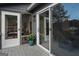 Exterior view of entrance leading to screened porch, showcasing seamless indoor-outdoor living at 1190 Plantation Dr, Villa Rica, GA 30180
