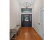 Inviting foyer featuring high ceilings, natural light, and hardwood floors at 1190 Plantation Dr, Villa Rica, GA 30180