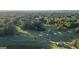 Scenic aerial view of a lush golf course surrounded by mature trees and landscaping at 1190 Plantation Dr, Villa Rica, GA 30180