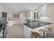 Bright kitchen with tile floors, white cabinets, gray countertops and stainless steel appliances at 1190 Plantation Dr, Villa Rica, GA 30180