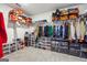 Walk-in closet with ample shelving and hanging space for clothes and accessories at 6910 Newcastle Ct, Fairburn, GA 30213