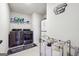 Efficient laundry room with modern washer and dryer, shelving, and stylish decor at 6910 Newcastle Ct, Fairburn, GA 30213