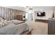 Spacious main bedroom with wood accent wall and large mirror at 6910 Newcastle Ct, Fairburn, GA 30213
