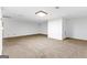 Spacious basement includes carpet floors, and white walls with trim at 180 Habersham Pl, Fayetteville, GA 30214