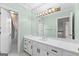 Bathroom featuring a double vanity, large mirror, and tub-shower combo at 180 Habersham Pl, Fayetteville, GA 30214