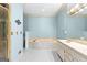 A bathroom featuring a vanity with dual sinks, a tub, and a separate shower at 180 Habersham Pl, Fayetteville, GA 30214