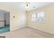 Bedroom includes a ceiling fan, carpet flooring, and a large window at 180 Habersham Pl, Fayetteville, GA 30214
