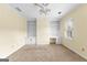Bedroom featuring neutral walls, carpeted floors, and built-in shelving at 180 Habersham Pl, Fayetteville, GA 30214