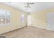 Bedroom with neutral walls, carpeted floors, and shuttered windows at 180 Habersham Pl, Fayetteville, GA 30214