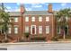 Charming brick townhouse with a red front door and classic architectural details at 180 Habersham Pl, Fayetteville, GA 30214