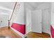 Bright hallway features hardwood flooring, a staircase and white walls at 180 Habersham Pl, Fayetteville, GA 30214
