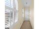 Hallway with a shuttered window and neutral carpeting at 180 Habersham Pl, Fayetteville, GA 30214