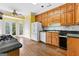 Kitchen featuring wood cabinets, tile backsplash, and stainless steel appliances at 180 Habersham Pl, Fayetteville, GA 30214