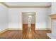 Open living area with hardwood floors, detailed trim, and a seamless flow to the dining room at 180 Habersham Pl, Fayetteville, GA 30214