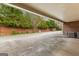 Covered parking area and storage, with mature landscaping at 180 Habersham Pl, Fayetteville, GA 30214